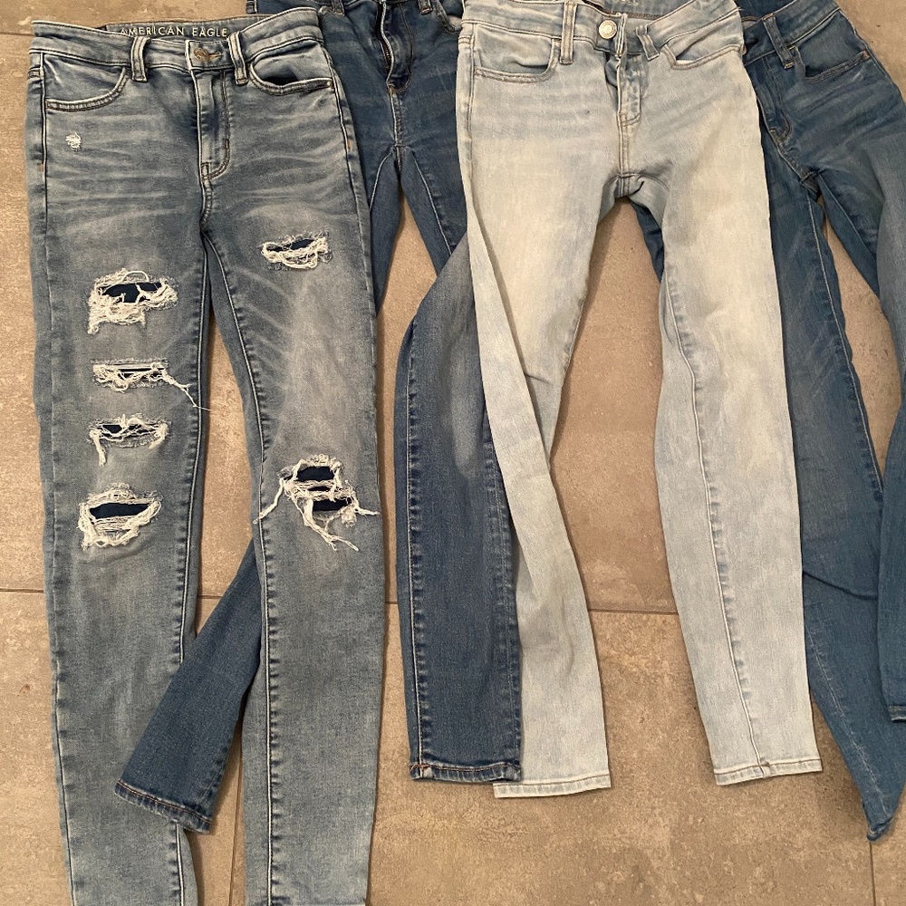 4 pairs of American Eagle jeans